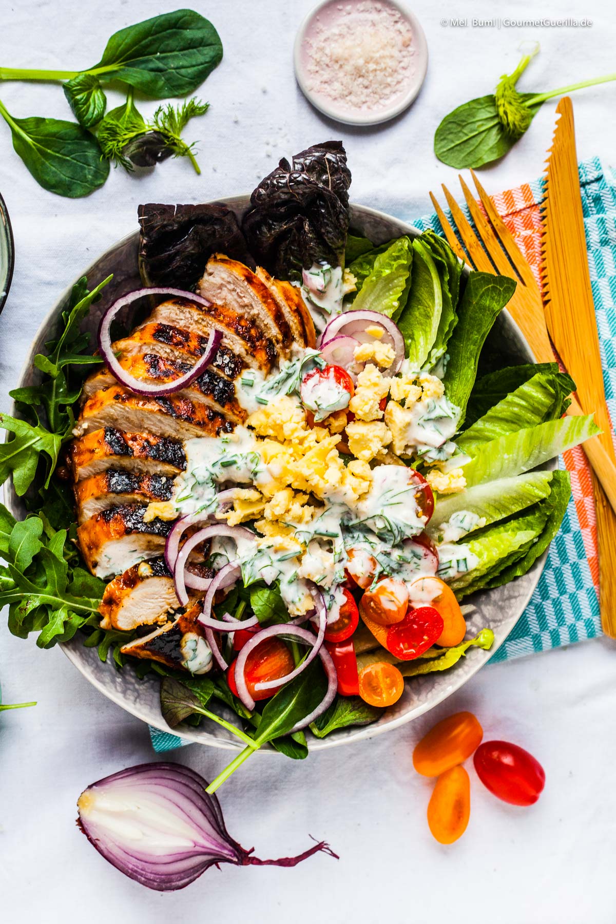 Biting BBQ chicken on salad with homemade Low-Fat Ranch Dressing | GourmetGuerilla.com 